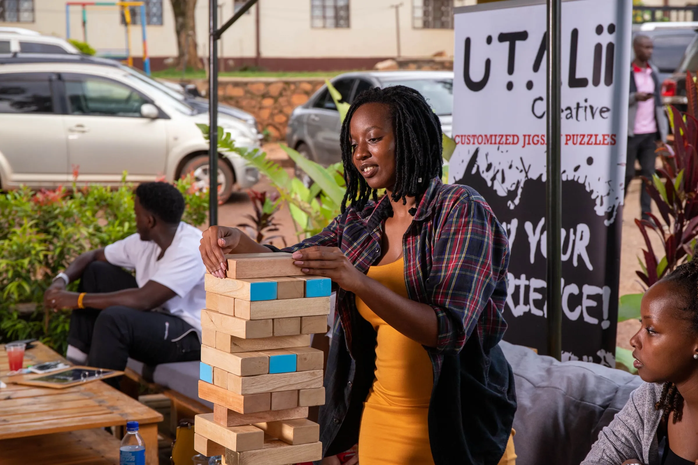 A player carefully pulling a block at an outdoor games night