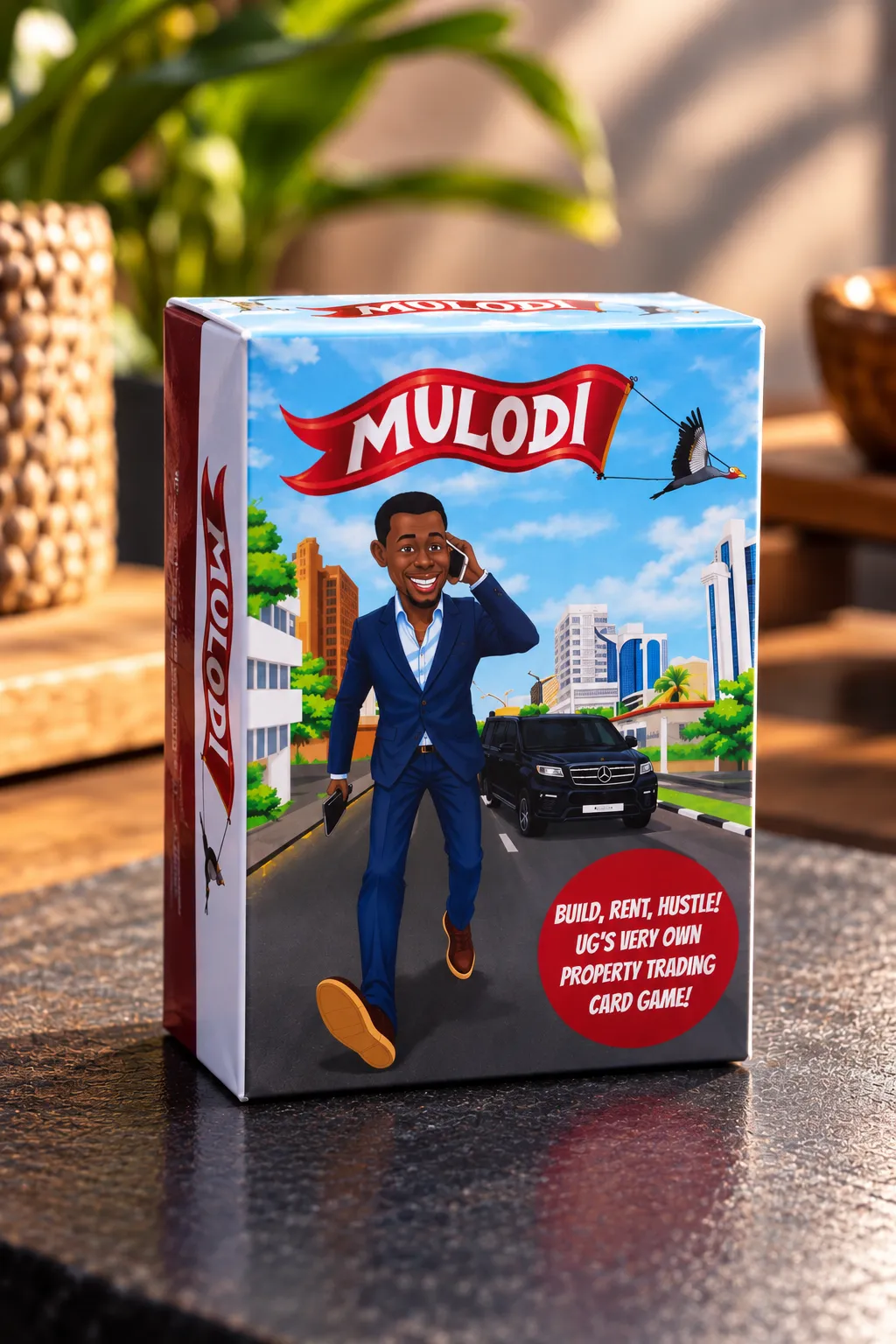 Original Mulodi box on a table, featuring the Mulodi character walking through Kampala